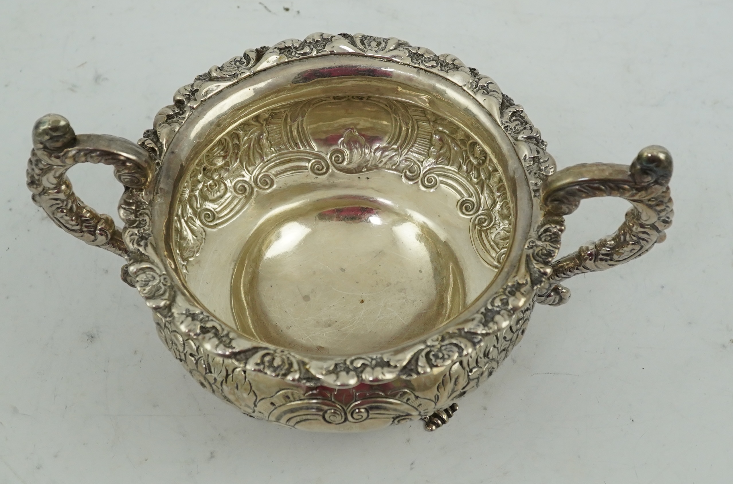 A George IV Irish embossed silver two handled sugar bowl, by James Scott